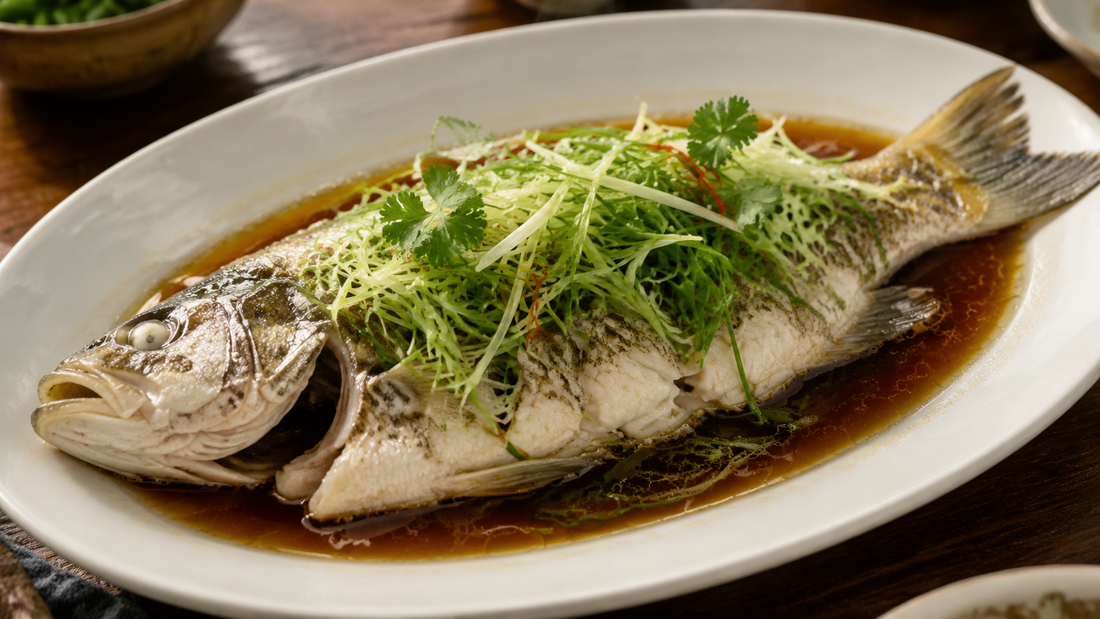 Cantonese whole steamed fish with ginger scallions cilantro and light soy sauce