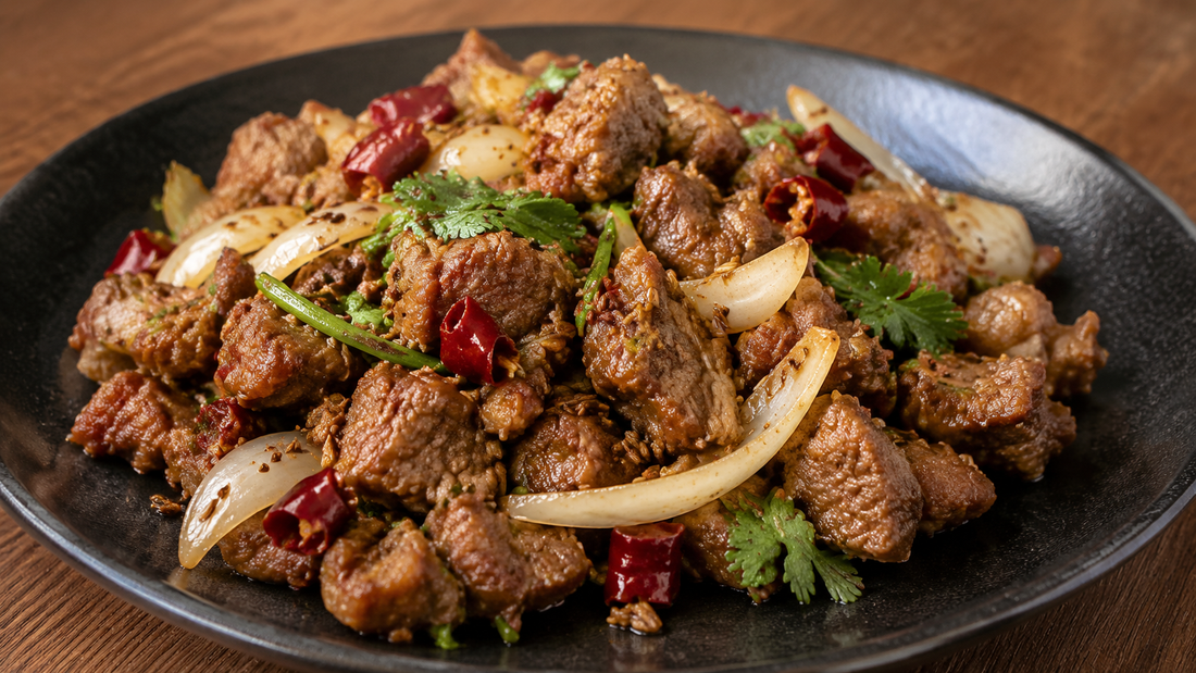 Xinjiang-style cumin lamb with toasted cumin seeds, dried red chiles, onion and cilantro